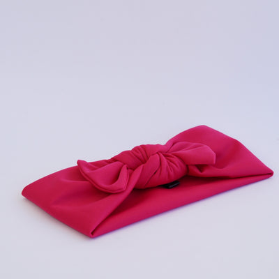 Mitigador banda con moño magenta